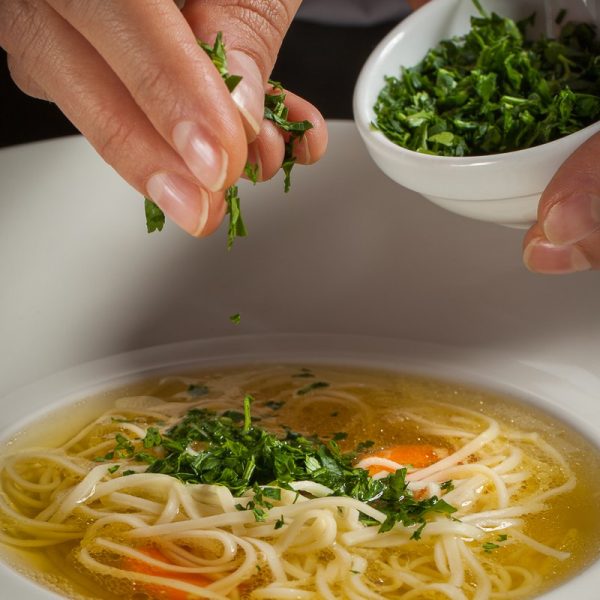 Chicken broth with meat dumplings or homemade noodles