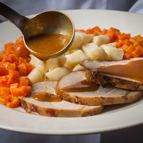 Milk veal with gravy with gnocchi