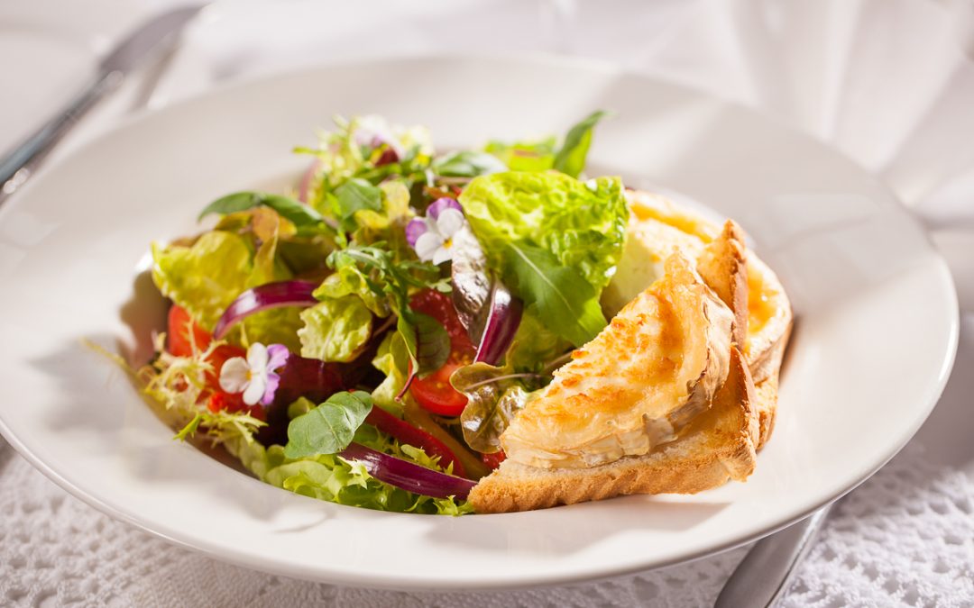 Salad with roasted peppers and goat cheese